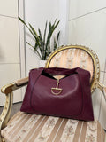 Borsa bordeaux in pelle con dettaglio oro
